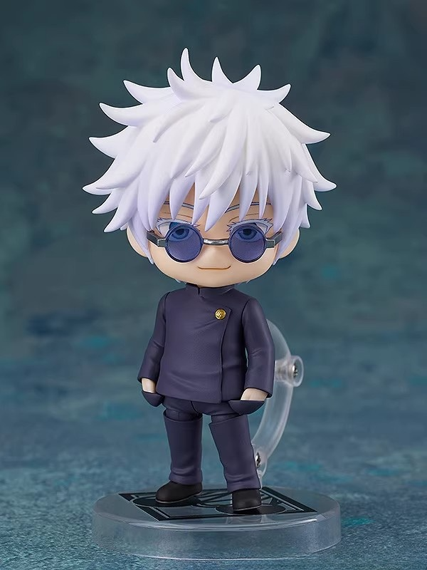 The Gojo Satoru Action Figure is a 12cm movable joint figure featuring Jujutsu Kaisen’s iconic character. It showcases white spiky hair, blue-tinted glasses, and a dark outfit, elegantly posed on a platform against a blue background—ideal for anime figure collectors.