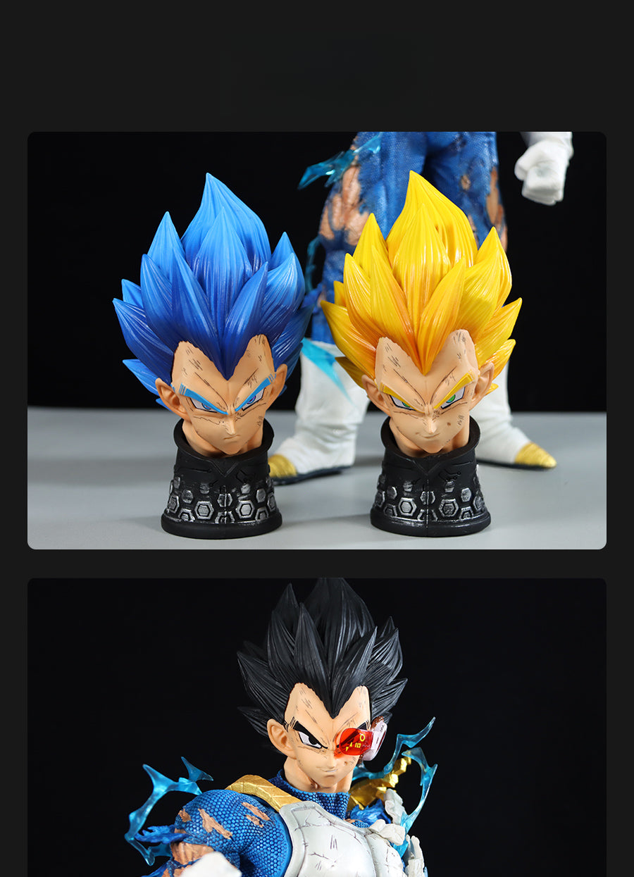 Displayed on the table are two anime character busts with spiked blue and yellow hair. Below them is a Seakoff Vegeta Collectible Figure from Dragon Ball Z, featuring 45cm size, four interchangeable heads, Super Saiyan forms, spiked black hair, and battle-worn armor. All share similar facial features.