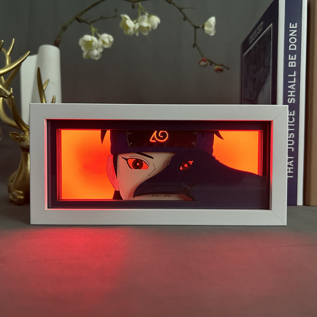 The Naruto Anime Light Box showcases Itachi Uchiha with his black hair and headband, partly obscured by a dark cloak, against a vivid red background. Sharingan eyes glow subtly near a vase with white flowers and the book "That Justice Shall Be Done.