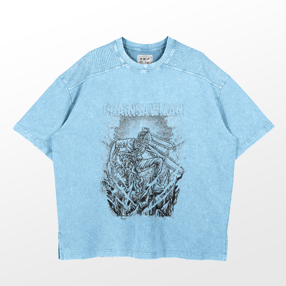 The Chainsaw Man Washed Vintage T-Shirt is a light blue oversized tee made from 260 GSM high-quality cotton. It features a rugged chainsaw figure graphic with "CHAINSAWMAN" in a stylized font, boasting a distressed, textured finish for an authentic anime streetwear vibe.