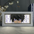 The Death Note Anime Light Box, featuring L (Lawliet) in anime-style with dark hair and purple eyes, includes a 3D-effect white "L" pattern background. A decorative floral branch and book enhance the scene. This 16-color adjustable LED light is a product of the Death Note brand.