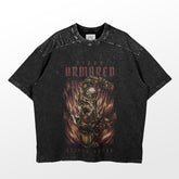 This Armored Titan Reiner Braun T-shirt by Attack on Titan features a detailed character illustration with bold red "Titan Armored" text and an abstract fiery background, completing the intense anime design with speckled texture.