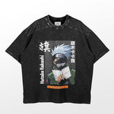 This black Naruto T-shirt displays an illustration of spiky-haired, masked Hatake Kakashi holding a book. The anime apparel boasts "Hatake Kakashi" and "Supreme" in white text, and its fabric has a slightly washed-out, mottled texture.