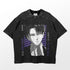 The Levi Ackerman Signature T-Shirt features the anime character with short dark hair, wearing a collared shirt and tie against a background of purple stripes and Japanese text. "Levi Ackerman" runs vertically on the left. It&
