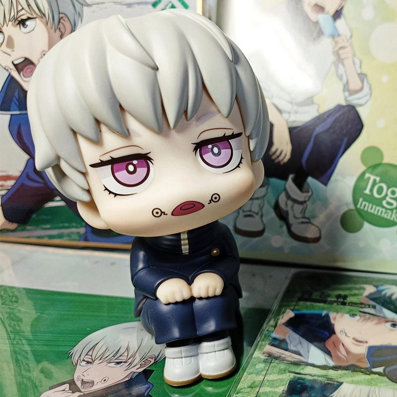 The Toge Inumaki Anime Figure features a cross-legged pose with white hair and pink eyes. As part of the Jujutsu Kaisen collection, this 12cm rotatable head figure serves as a vibrant collectible centerpiece with colorful illustrations and merchandise for any fan&