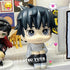 A Yuta Okkotsu figure from the Jujutsu Kaisen collection sits on a shelf in light attire. A small giraffe toy and another chibi figure with dark hair and a hat are nearby. Emoticons like hearts and a dog bone float around, with the handle "@okkotsu_yuta" visible.