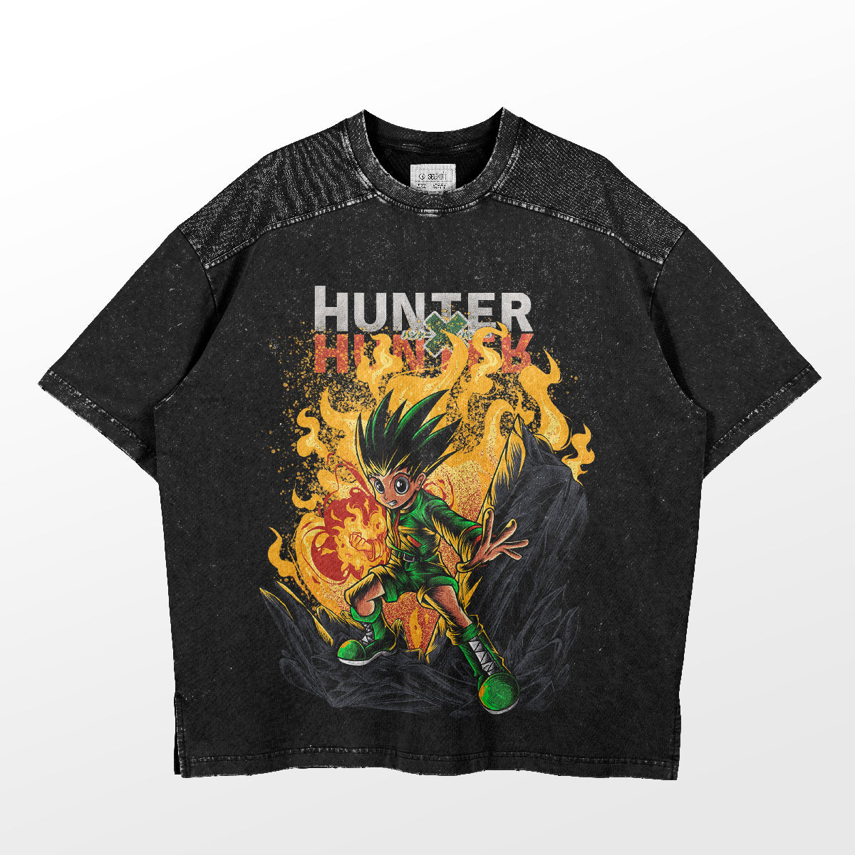 The Hunter x Hunter "Gon Freecss Fiery Power" Graphic T-Shirt features Gon with his spiky hair and green outfit on a fiery background. Hints of "Hunter" and "H" adorn it, making this vibrant black and orange anime apparel perfect for any collection.
