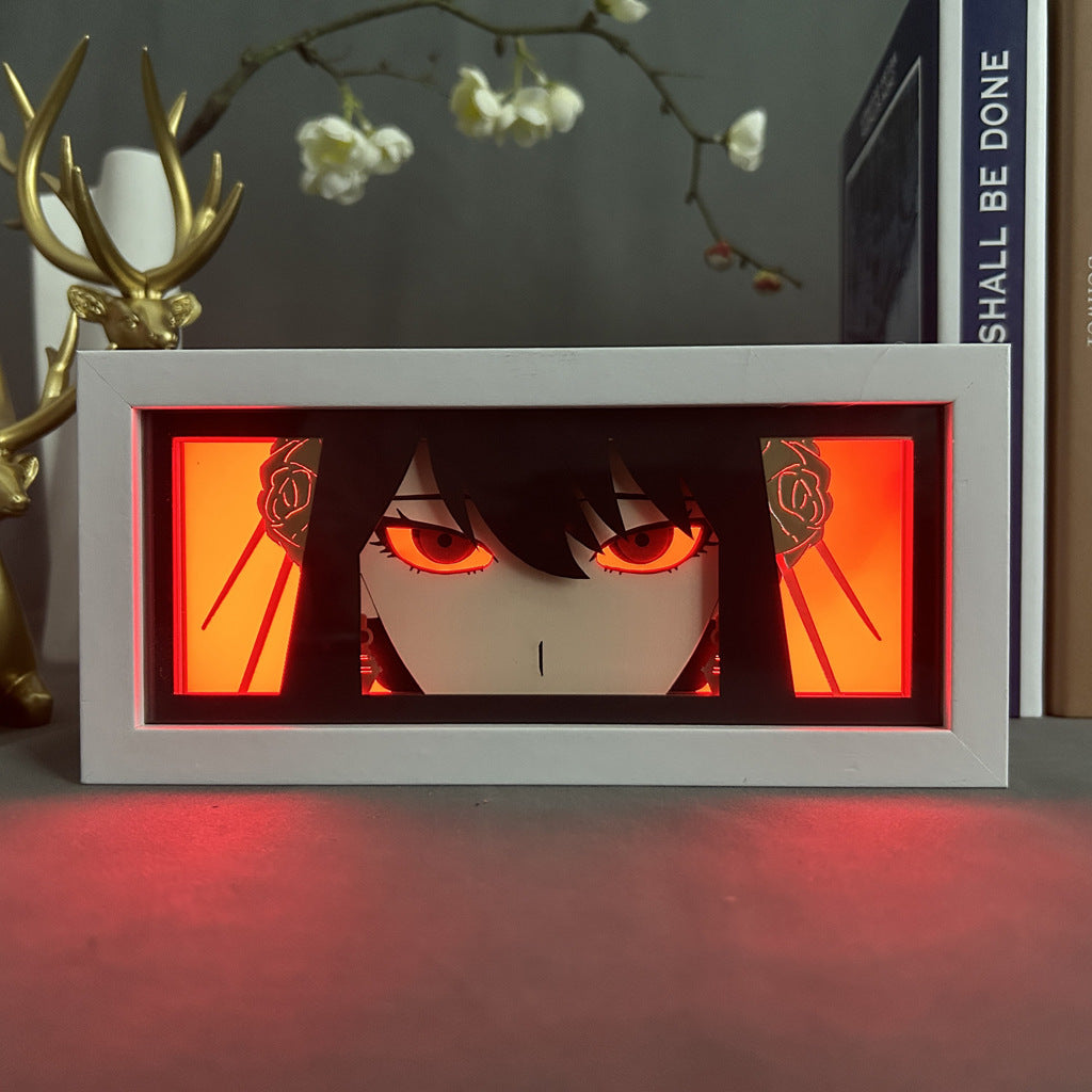 A framed piece on a shelf features a character with intense eyes and dark hair against a red-orange background, ideal for Spy × Family fans. With floral branches and a decorative deer antler stand, it pairs perfectly with your Yor Forger LED Light Box – Spy x Family 3D Anime Lamp.