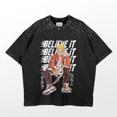 The Believe It Naruto T-Shirt by Naruto is perfect for anime fans. It features a character in an orange outfit and sneakers, sitting thoughtfully, with "BELIEVE IT" in bold white letters behind him and Japanese characters on the side. This exclusive design represents premium anime apparel.