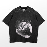 The Berserk-inspired graphic T-shirt is a washed black oversized tee, blending vintage streetwear with intricate linework of a kneeling knight presenting a sword to a seated figure, reminiscent of Berserk&