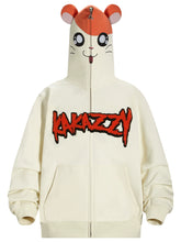 This Cute Hamster Cartoon Hoodie by Seakoff, made from 400GSM cotton, features a playful ear design on its cream-colored hood with a cute hamster face. "KANAZZY" is prominently displayed in red and black on the front. A central zipper adds convenience, making it ideal for cartoon enthusiasts.