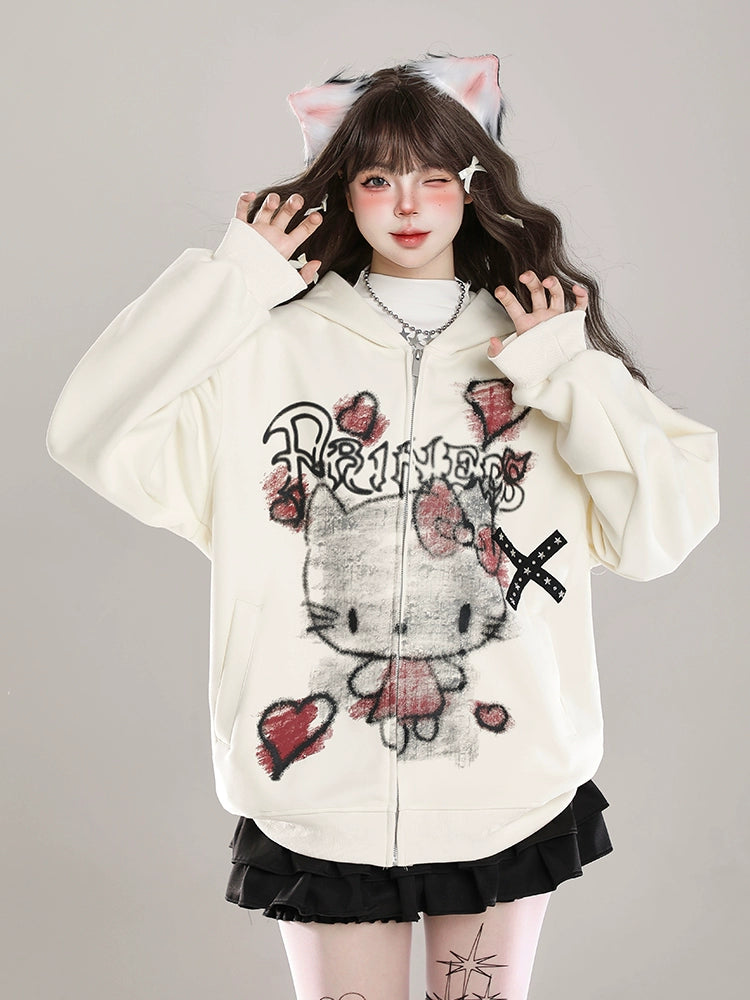 Sporting a Seakoff Gothic Hello Kitty Princess Hoodie with edgy heart and cross graphics, paired with a black skirt and cat ear accessories, someone embodies kawaii fashion against a gray background with alternative flair.