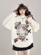 Sporting a Seakoff Gothic Hello Kitty Princess Hoodie with edgy heart and cross graphics, paired with a black skirt and cat ear accessories, someone embodies kawaii fashion against a gray background with alternative flair.