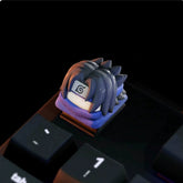 Close-up of a Naruto keycap from the Naruto Keycaps Set by Naruto on the "1" key, showcasing a styled character with dark spiky hair and a forehead emblem, perfect for anime fans.