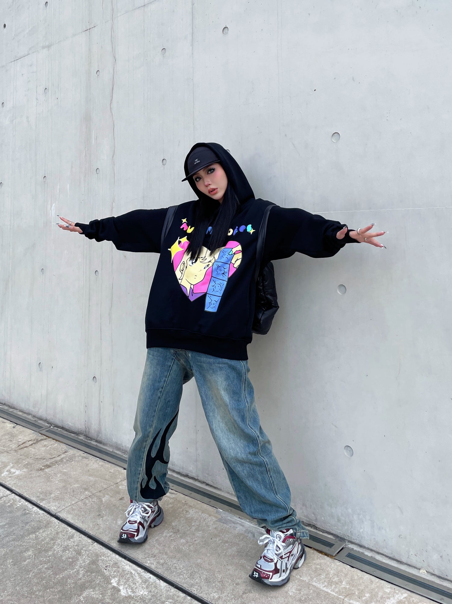 A person poses against a concrete wall wearing Seakoff&