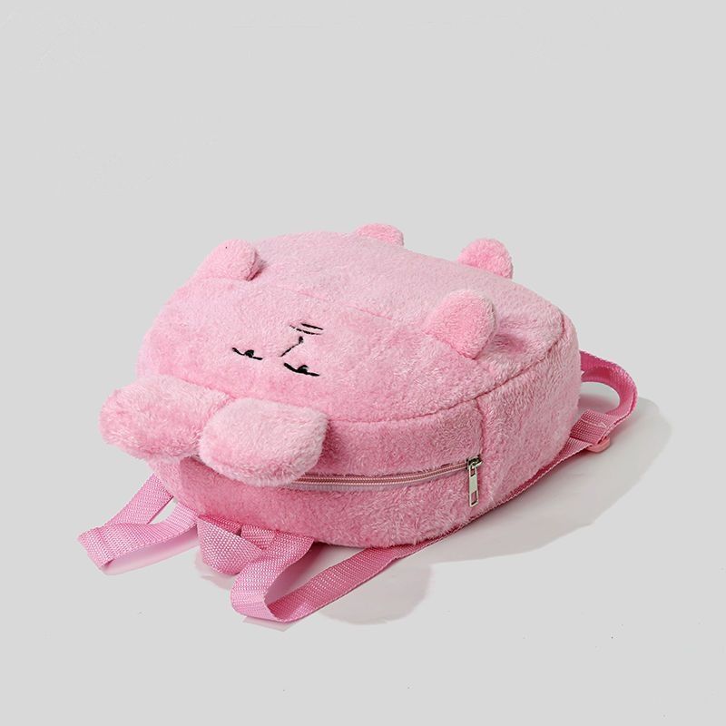 The Seakoff Quirky Pink Bunny Plush Backpack features a sleeping bunny design with embroidered eyes, nose, cute ear details, a bow on top, and pink straps—ideal for adding whimsy to your look.