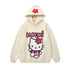 The Seakoff Kawaii Hello Kitty Oversized Hoodie features the beloved character in pink with a flower design, "Kuromi" in pink and black lettering, and a charming pink flower on the hood. Perfect for kawaii fashion lovers!.
