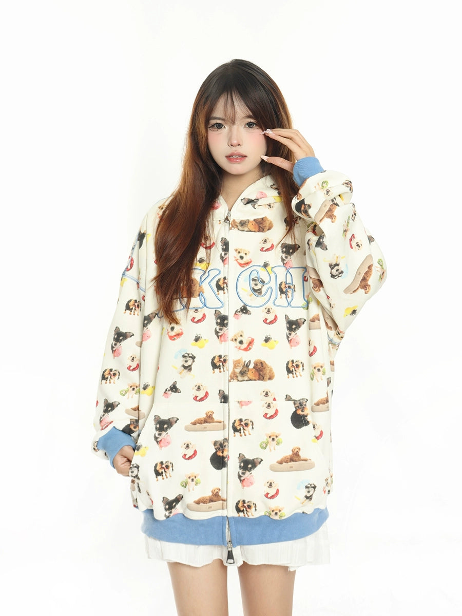 A person with long brown hair stands against a white background, wearing a Seakoff MKCH Dog Print Hoodie, adorned with a cute puppy pattern. The hoodie features blue cuffs and hem. They look at the camera neutrally, perfectly capturing dog-themed fashion for enthusiasts.