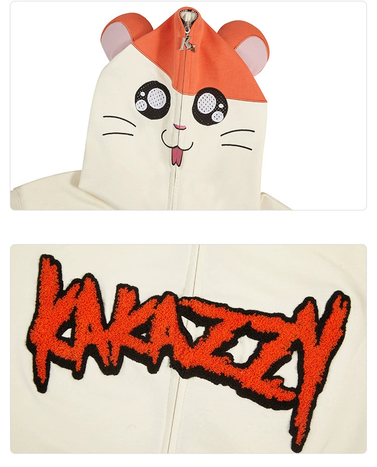The Cute Hamster Cartoon Hoodie by Seakoff is made of 400GSM cotton and features a cartoon hamster face with ears on the hood, plus "KAKAZZY" embroidered in bold, jagged orange letters outlined in black—perfect for cartoon lovers.