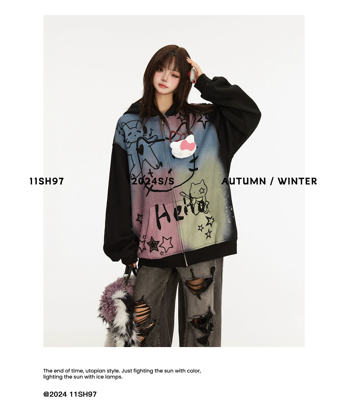 A person with long hair wears a Seakoff Pastel Cat Graffiti Hoodie, featuring vibrant cat and star designs. They pair it with ripped jeans and hold a small bag. The image displays "11SH97 2024 S/S AUTUMN / WINTER" and emphasizes streetwear style with a tagline at the bottom.