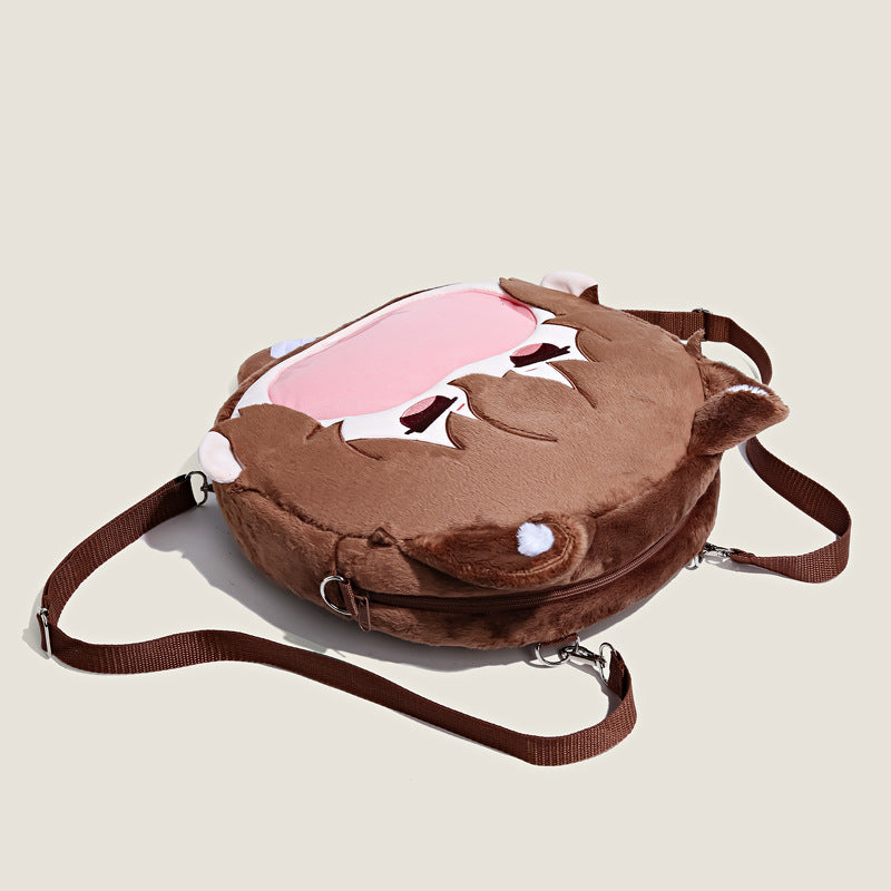 The Seakoff Bungo Stray Dogs Atsushi Nakajima Plush Shoulder Bag, featuring an animal face with ears and a pink and white pattern, comes with adjustable straps and a zipper closure. Its cute anime design includes a transparent mouth pocket.