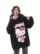 A person showcases a Seakoff black oversized hoodie, perfect for Sanrio fans, featuring Kuromi&