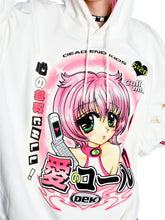 A person is wearing the Seakoff Y2K Aesthetic Anime Hoodie, featuring a kawaii white design with an anime character with pink hair and a flip phone surrounded by Japanese text and phrases like "Dead End Kids" and "Call me," highlighted by bold colors that enhance its Y2K style.