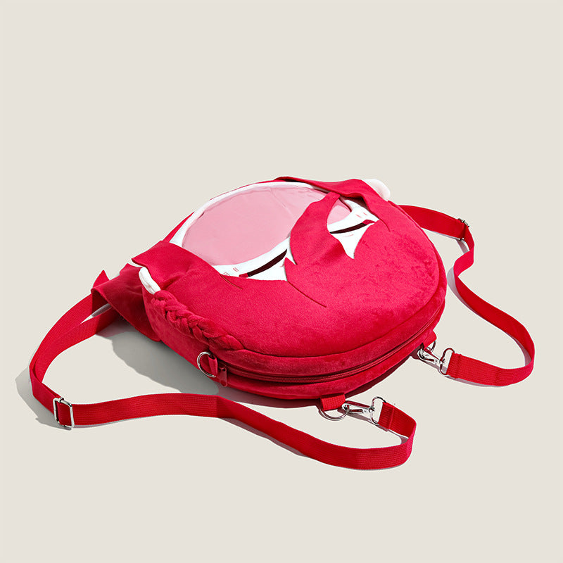 The Seakoff Blue Lock Chigiri Hyoma Plush Shoulder Bag features a sporty red circular design with white accents, silver buckles, and red adjustable straps. Its unique transparent mouth pocket blends style and function, inspired by anime flair.
