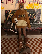 A person in a Seakoff Freddy-Inspired Hoodie, an oversized brown zip-up Five Nights at Freddy&