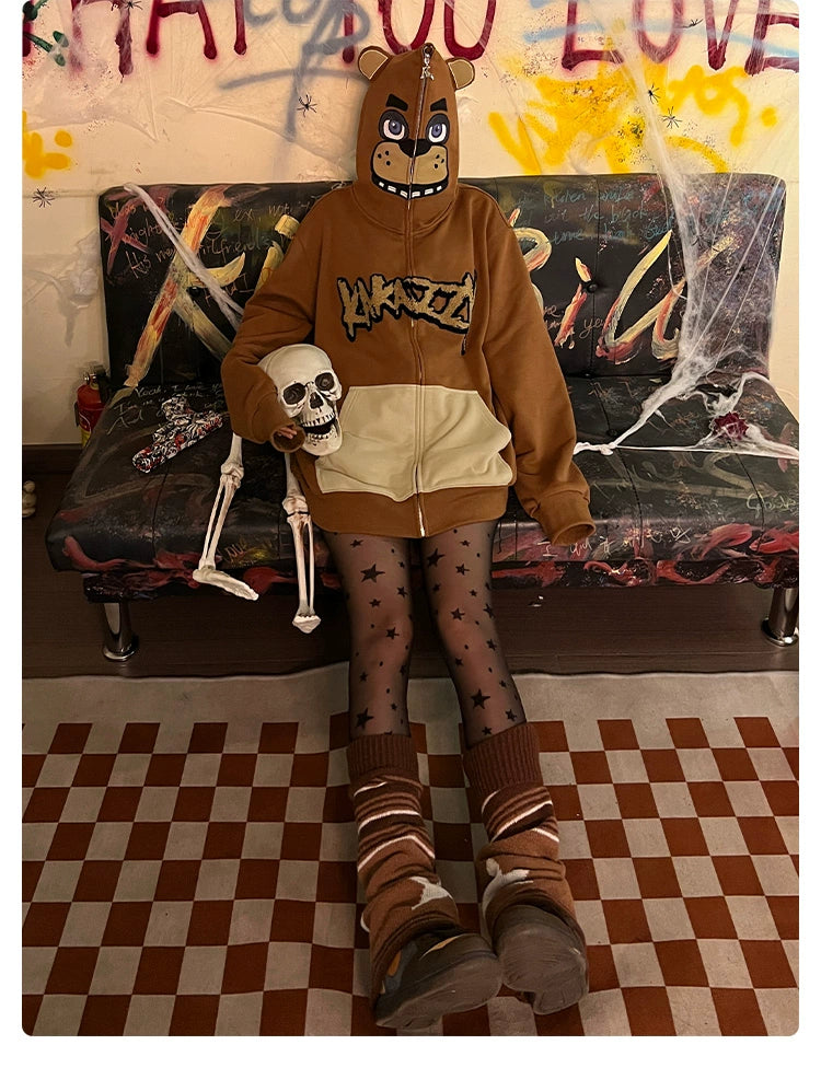 A person in a Seakoff Freddy-Inspired Hoodie, an oversized brown zip-up Five Nights at Freddy&