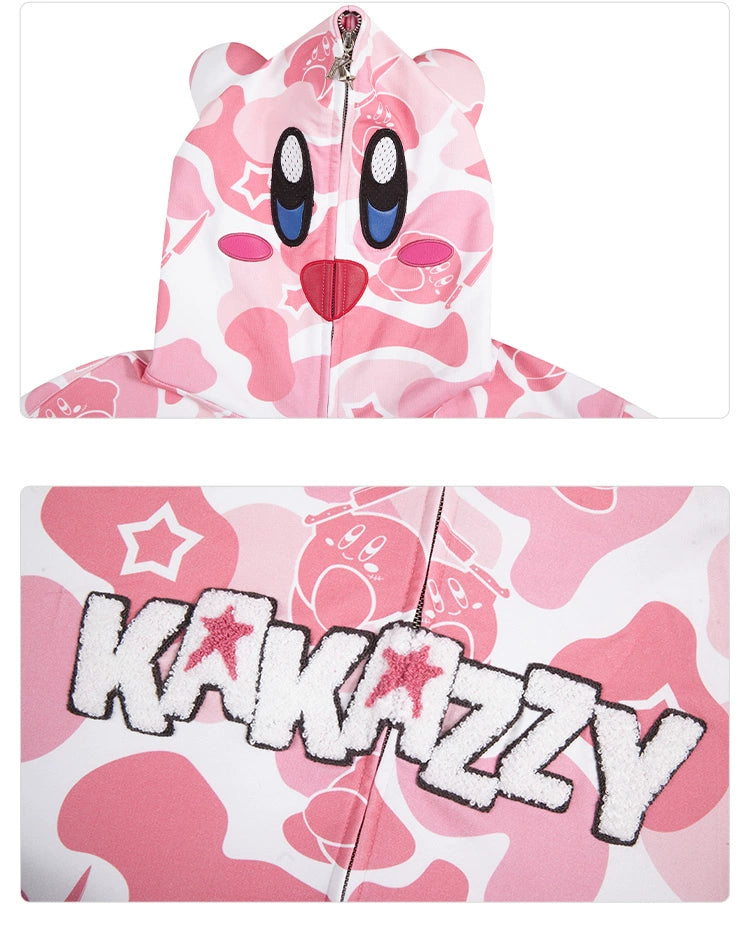 The Seakoff Pink Kirby-Inspired Hoodie features a pink and white design with a cartoon face on the hood, large eyes, a smile, 3D ears, and playful pink camo print with stars. "KAKAZZY" is boldly displayed—a true embodiment of the Kirby spirit. Crafted from 400GSM cotton.