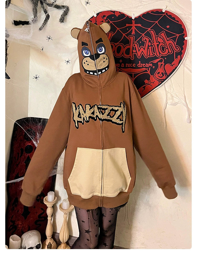 A person wears a Seakoff Freddy-Inspired Hoodie, a 400GSM oversized brown zip-up reminiscent of Five Nights at Freddy&