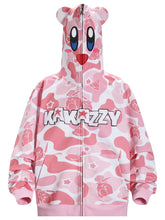 The Seakoff Pink Kirby-Inspired Hoodie features a cartoon face on the hood with large eyes, red mouth, playful 3D ears, white and pink patterns with star motifs, and "KAWAZZY" across the chest over a unique pink camo print. Made from 400GSM cotton.