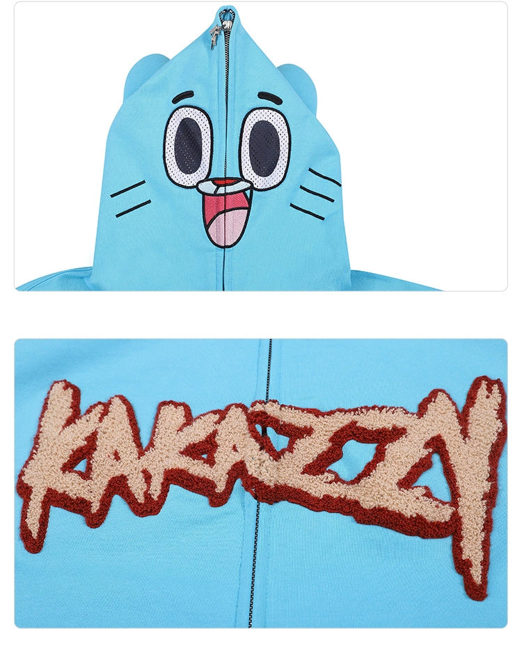 The Seakoff Adorable Blue Cartoon Hoodie, crafted from 400GSM cotton, features a playful face with eyes and a smile on the hood. The oversized fit ensures comfort and style, with "KAKAZZY" embroidered in large, textured letters below.