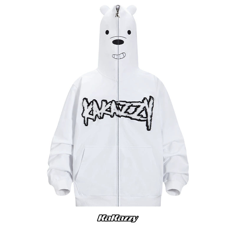 The Seakoff Cute White Bear Hoodie features a charming bear face on the hood with ears and a smile. Its oversized fit has a graffiti-like logo across the chest and "Kakazzy" branding at the bottom, crafted in 400GSM fabric with black embroidery for cozy days.