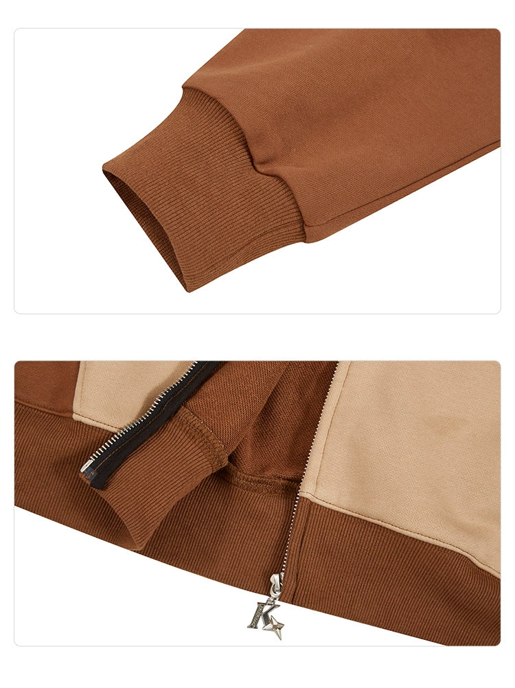 A close-up of a brown cuff on a sleeve from the Seakoff Freddy-Inspired Hoodie showcases this oversized brown and beige zip-up sweatshirt with a distinctive pull tab. Made from 400GSM material, it&