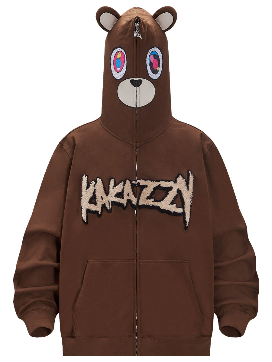 Embrace streetwear with Seakoff’s Cute Bear Hoodie, an oversized 400GSM brown zip-up. Featuring embroidered bear ears, a colorful face on the hood, bold "Kakazin" on the front, and two handy pockets, it offers a fun and unique look.