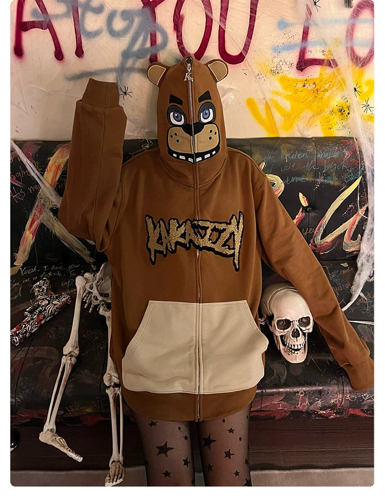 A person wears a Seakoff Freddy-Inspired Hoodie with a bear face hood, posing with one arm up. They&