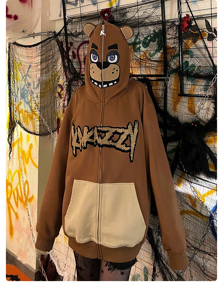 The Seakoff Freddy-Inspired Hoodie is a 400GSM oversized brown zip-up sweatshirt featuring a bear face hood and "KAWAII" text, ideal for Five Nights at Freddy&