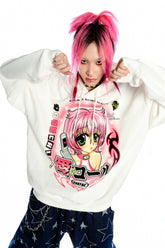 Against a white backdrop, a person with pink hair and facial piercings casually holds the strings of a Seakoff Y2K Aesthetic Anime Hoodie featuring an anime-style pink-haired girl holding a phone.