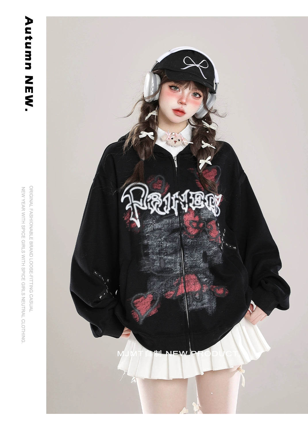A person wearing headphones and the Seakoff Gothic Hello Kitty Princess Hoodie – an oversized zip-up with edgy heart and cross graphics – paired with a white skirt, captures kawaii fashion. The neutral gray background adds alternative charm, with "Autumn NEW" text beside.