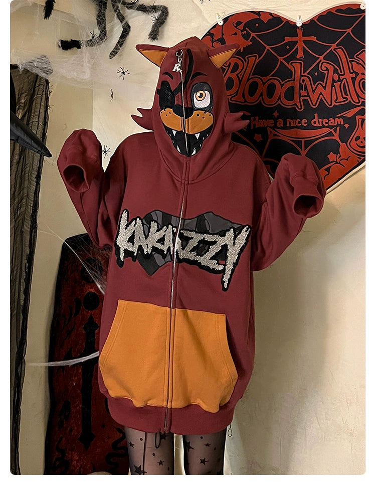 A person is wearing a Seakoff Foxy-Inspired Hoodie, an oversized red zip-up sweatshirt featuring an animatronic character from Five Nights at Freddy&