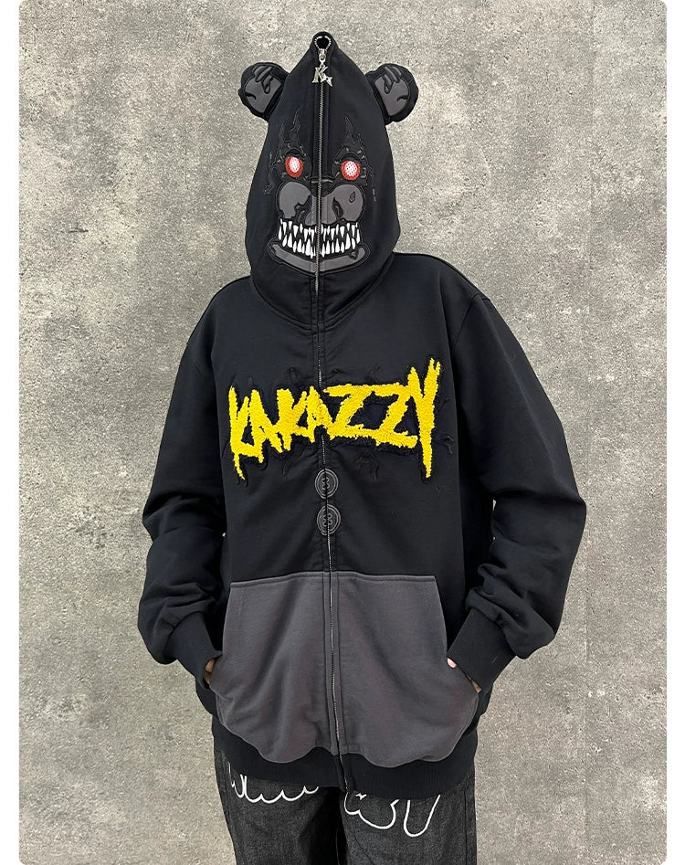 The Seakoff Dark Bear Demon Hoodie is perfect for horror fans with a menacing bear design on 400GSM cotton. It features red eyes and sharp teeth on the hood, which zips up to conceal the face, with "KANAZZY" boldly embroidered in yellow on this chilling black streetwear.