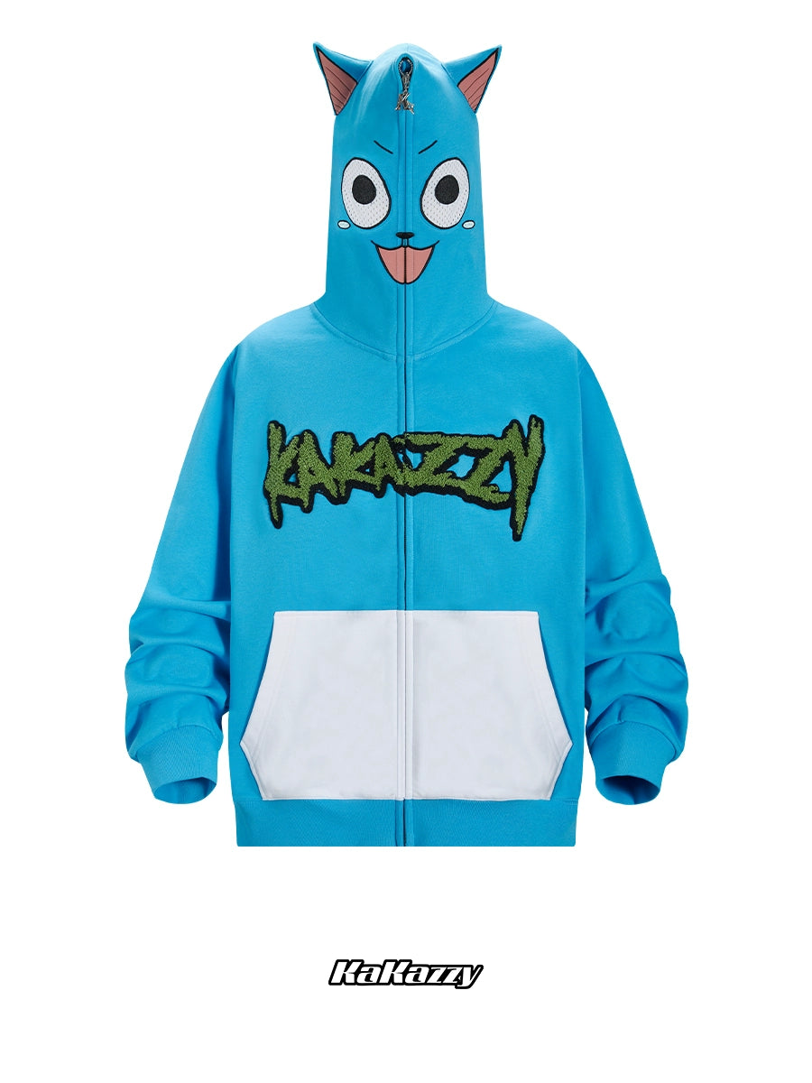 The Seakoff Anime Cat Hoodie is an oversized blue zip-up sweatshirt with ears, featuring a kawaii cartoon face on the hood. It includes long sleeves, white pockets, and "Katarzy" in green stylized text on the chest, perfect for anime streetwear lovers.