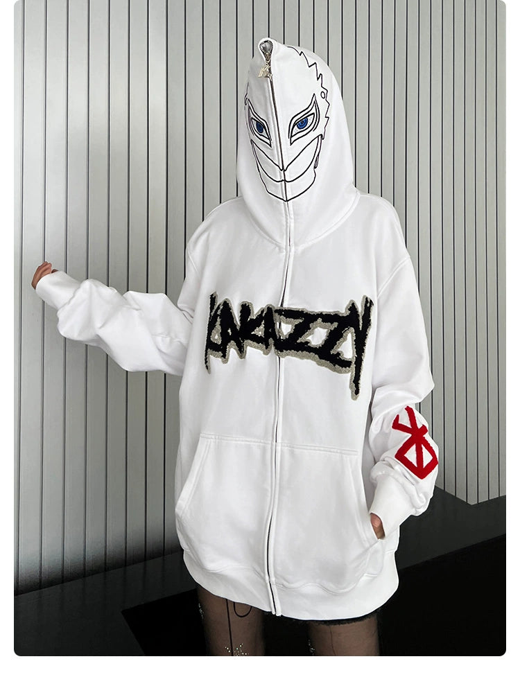 A person stands against a striped background wearing the Berserk Griffith-Inspired Hoodie, a white oversized zip-up sweatshirt featuring a face graphic on the hood, bold "AMAZZY" lettering, and a red design on the right sleeve. Perfect for anime fans!.