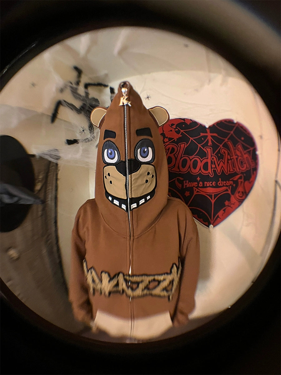 Someone sports a Seakoff Freddy-Inspired Hoodie, an oversized brown zip-up sweatshirt reminiscent of Five Nights at Freddy&