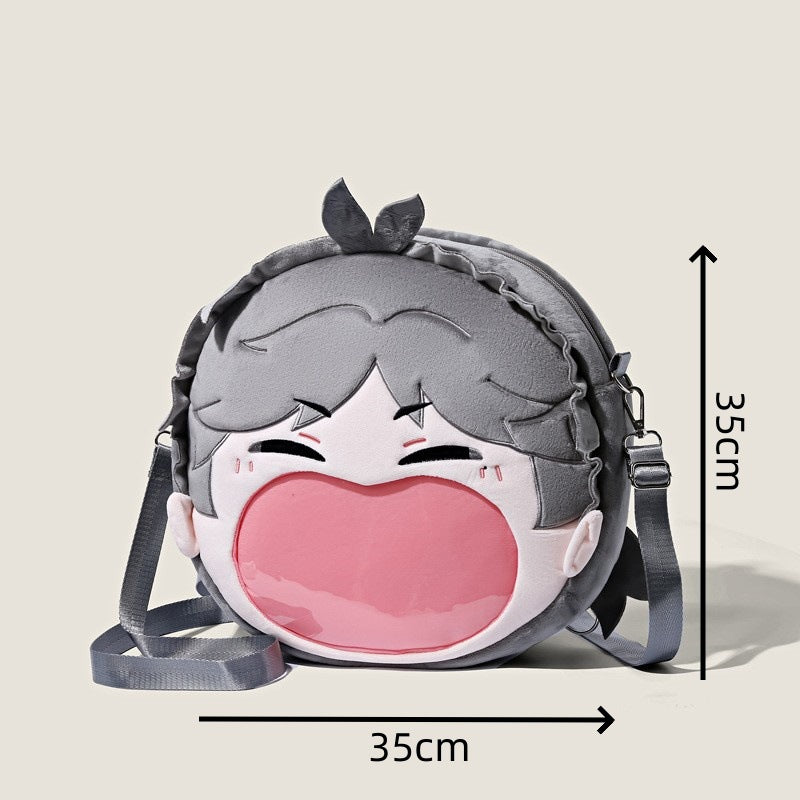 The Seakoff Haikyuu!! Kageyama Tobio Plush Shoulder Bag features a round design with a cartoon face, including gray hair and a large pink smile. Measuring 35 cm, it has a gray adjustable strap and is an ideal anime cosplay accessory with a transparent mouth pocket for easy carrying.