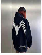 A person stands with their back to the camera, embodying streetwear fans&
