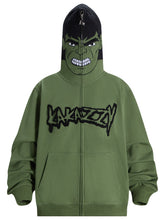 The Hulk-Inspired Hoodie by Seakoff is a 400GSM oversized green zip-up sweatshirt featuring a cartoon-like angry face and "LAKAZOOY" in stylized letters. Perfect for superhero fans and streetwear lovers, it delivers a fierce look ideal when zipped up.