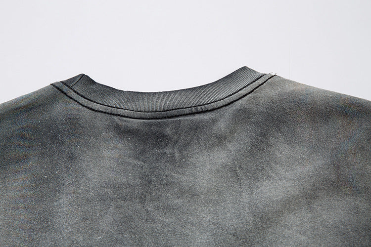 The back of the Limited Edition Death Note Long Sleeve Shirt in a black & gray gradient with distressed design and artistic hem showcases the neckline and shoulders, embodying anime streetwear style.